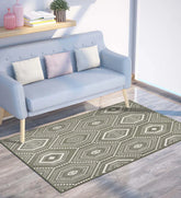 Machine washable taupe and ivory geometric patterned rug.